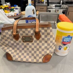 Louis Vuitton Hempstead leather. 
Date code TH0079